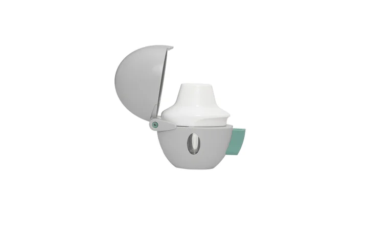 White handheld inhaler device with an open hinged cover, shown against a white background.