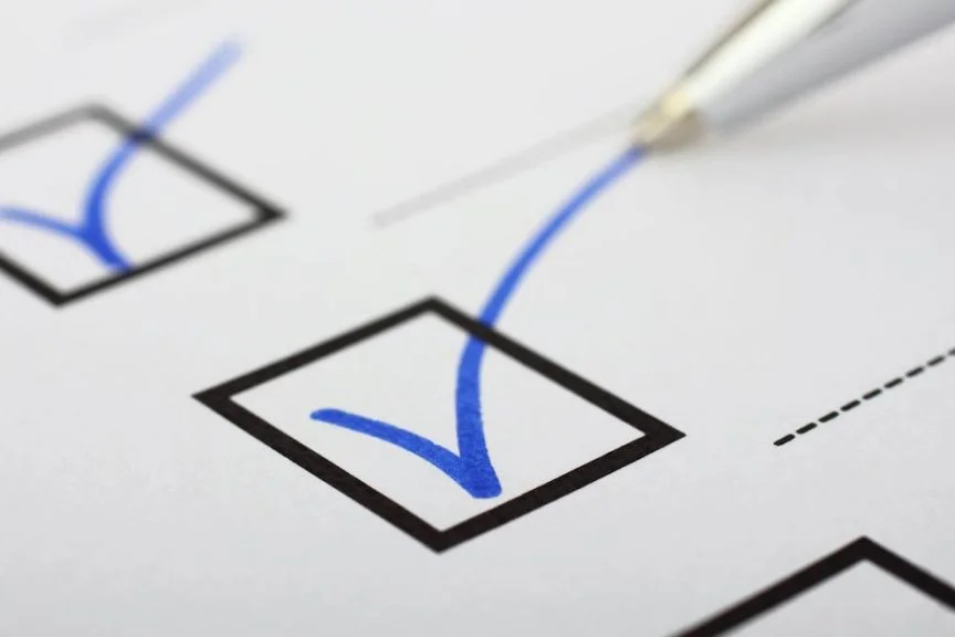 form square with a blue checkmark and a pen in the corner